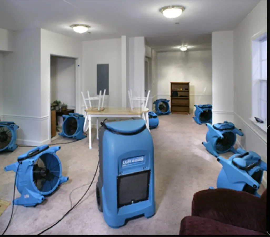 Air movers and dehumidifier setup for Water Damage Restoration in Graham